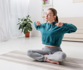 Slim girl practicing yoga indoors Stock Photo 03