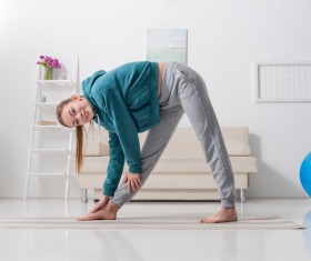 Slim girl practicing yoga indoors Stock Photo 09