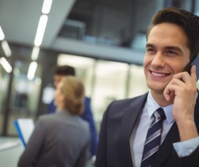 Smiling man is calling girlfriend Stock Photo