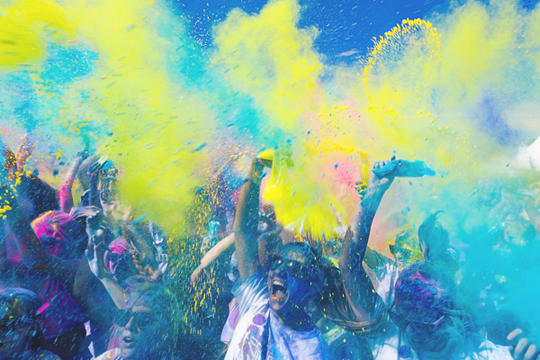 Spectators excited in color festival Stock Photo