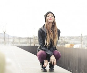 Squatting On the ground Red lips girl Stock Photo