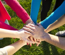 Stacked hands Stock Photo