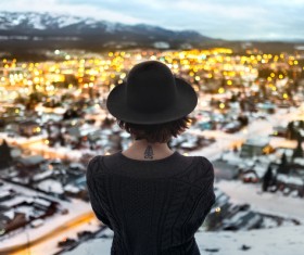 Stylish woman watching cityscape from height Stock Photo