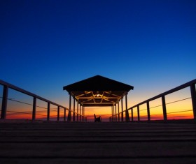 Twilight at night with wooden pier Stock Photo
