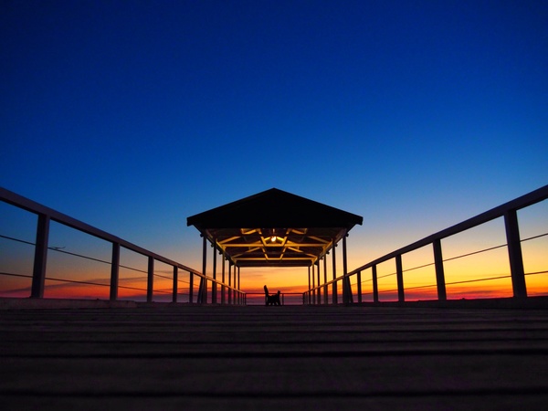 Twilight at night with wooden pier Stock Photo
