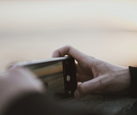 Use smartphone Shoot sunset Stock Photo