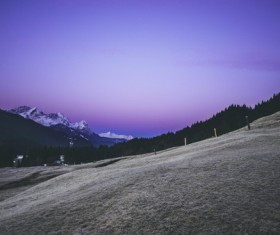Violet sky above mountain hill landscape Stock Photo