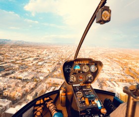 Watching cityscape on helicopter cabin Stock Photo