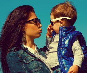 Wearing sunglasses young mother and child Stock Photo 01