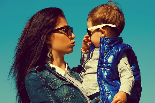 Wearing sunglasses young mother and child Stock Photo 01