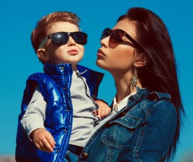 Wearing sunglasses young mother and child Stock Photo 02
