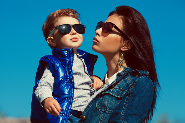 Wearing sunglasses young mother and child Stock Photo 02