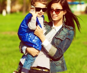 Wearing sunglasses young mother and child Stock Photo 03