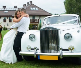 Wedding couple and white wedding car Stock Photo