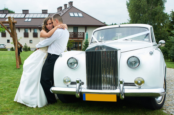 Wedding couple and white wedding car Stock Photo