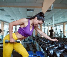 Woman doing arm exercise in the gym Stock Photo 02