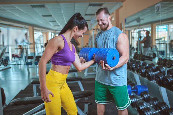 Woman doing arm exercise in the gym Stock Photo 04
