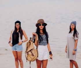 Woman dressed in different styles standing by the sea Stock Photo
