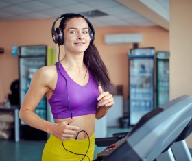 Woman exercising on a treadmill Stock Photo 03