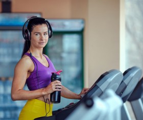 Woman exercising on a treadmill Stock Photo 04