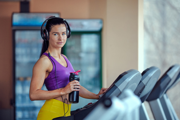 Woman exercising on a treadmill Stock Photo 04