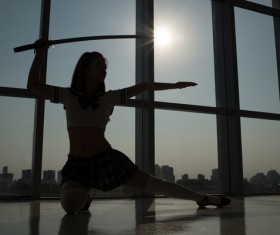 Woman practicing martial arts Stock Photo