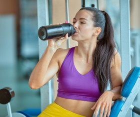 Woman resting after exercise in the gym Stock Photo 02