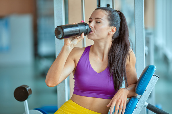Woman resting after exercise in the gym Stock Photo 02
