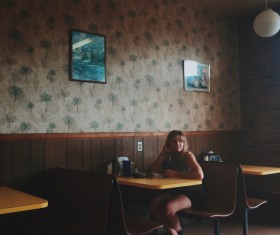 Woman sitting alone in the restaurant Stock Photo