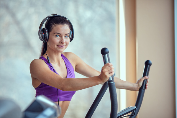 Woman with headphones doing fitness Stock Photo 02