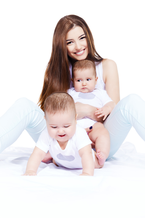 Young beautiful mother and two children Stock Photo 10