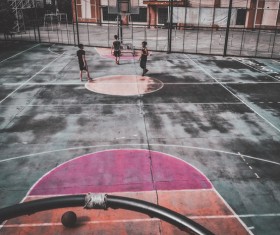 Young boy playing basket ball outdoor Stock Photo