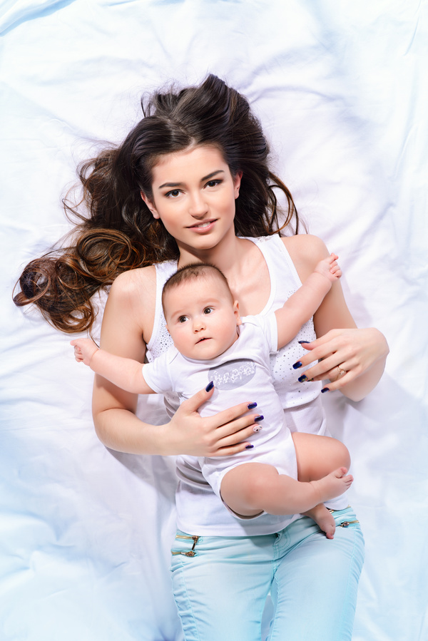 Young mother hugging her child Stock Photo 04