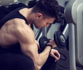 Young people working out at the gym Stock Photo 01