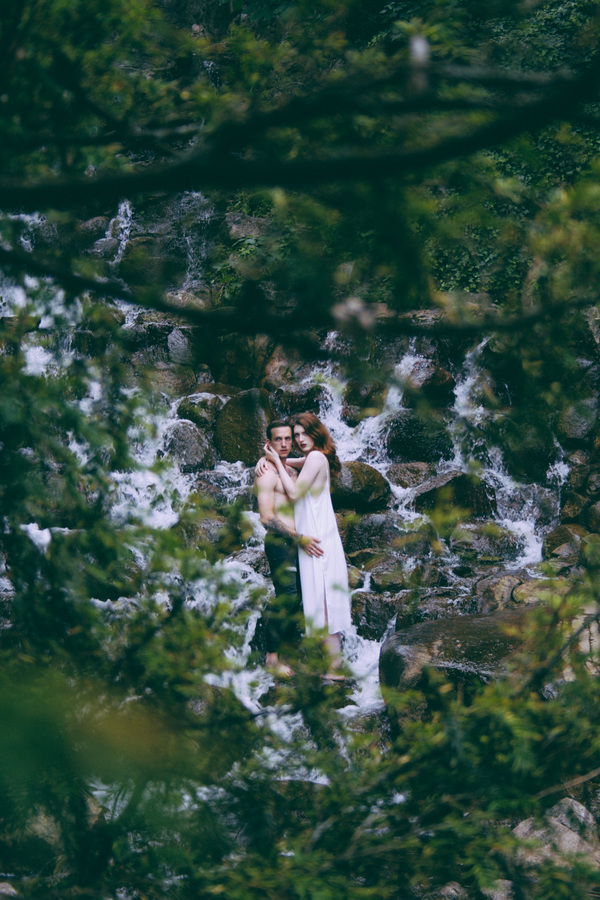 couple posing on wild stream landscape Stock Photo