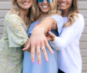 female friends posing with ring Stock Photo