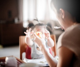 mother feeding the baby Stock Photo