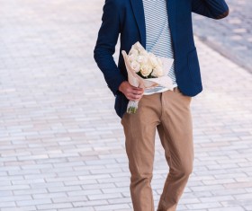 street holding flowers Man Stock Photo