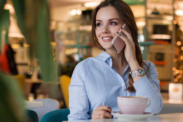 woman on the coffee house call up Stock Photo