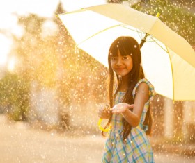 A girl holding an umbrella on a rainy day Stock Photo