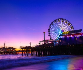 Amusement structure on beach at dusk Stock Photo