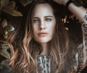 Beautiful Caucasian woman and plant Stock Photo