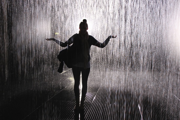 Black and white photo of girl in the rain Stock Photo