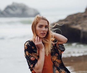 Blonde woman on the beach Stock Photo