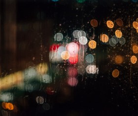 Bokeh light outside of wet glass Stock Photo