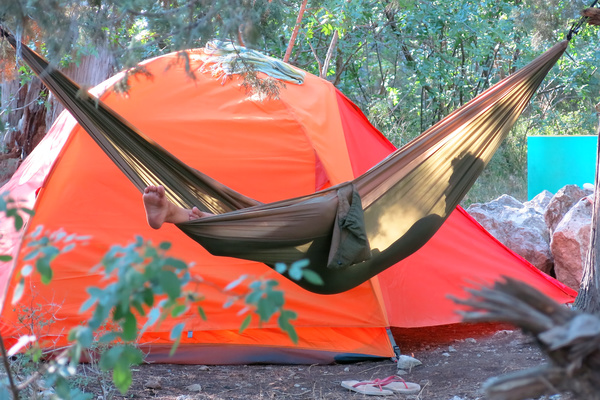 Camping tents and hammocks Stock Photo