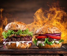 Cheese burger and flame Stock Photo