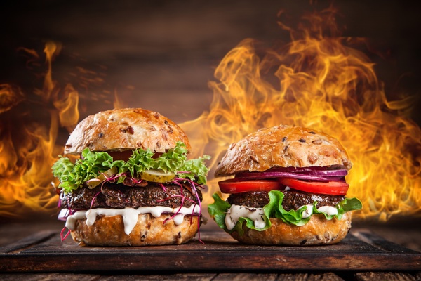 Cheese burger and flame Stock Photo