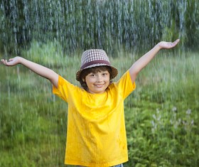 Children playing in the rain Stock Photo