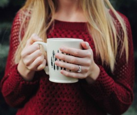 Closeup blonde girl holding cup Stock Photo
